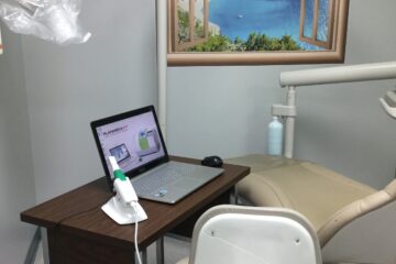 Dental chair with laptop and equipment
